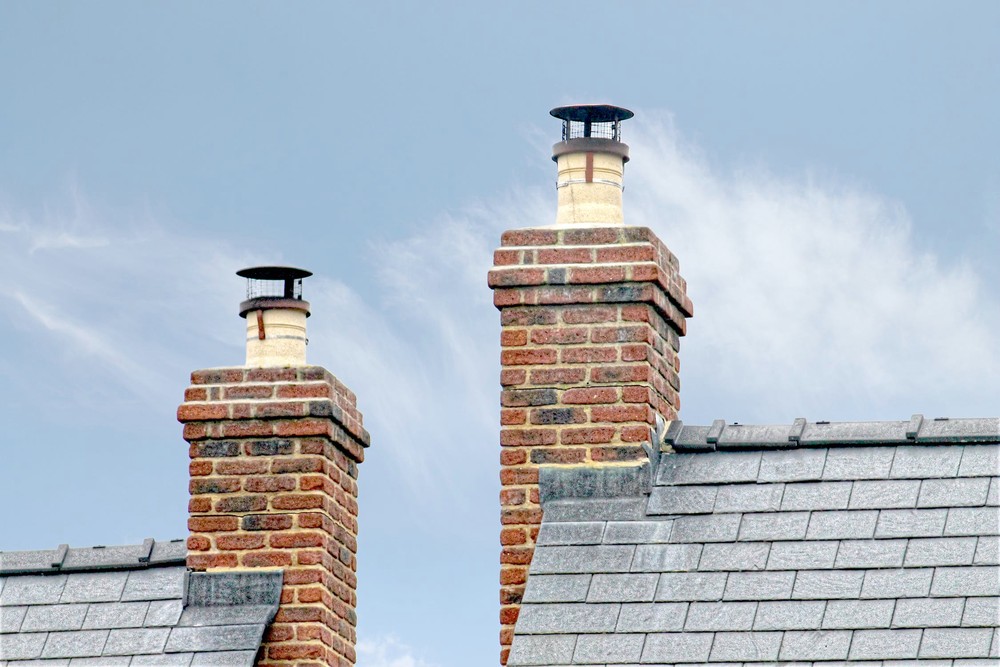 Two chimneys made of bricks and mortar  