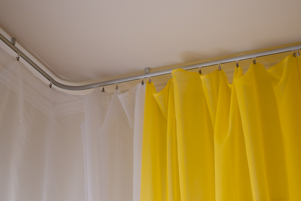 How Can You Install a Corner Window Curtain Track?